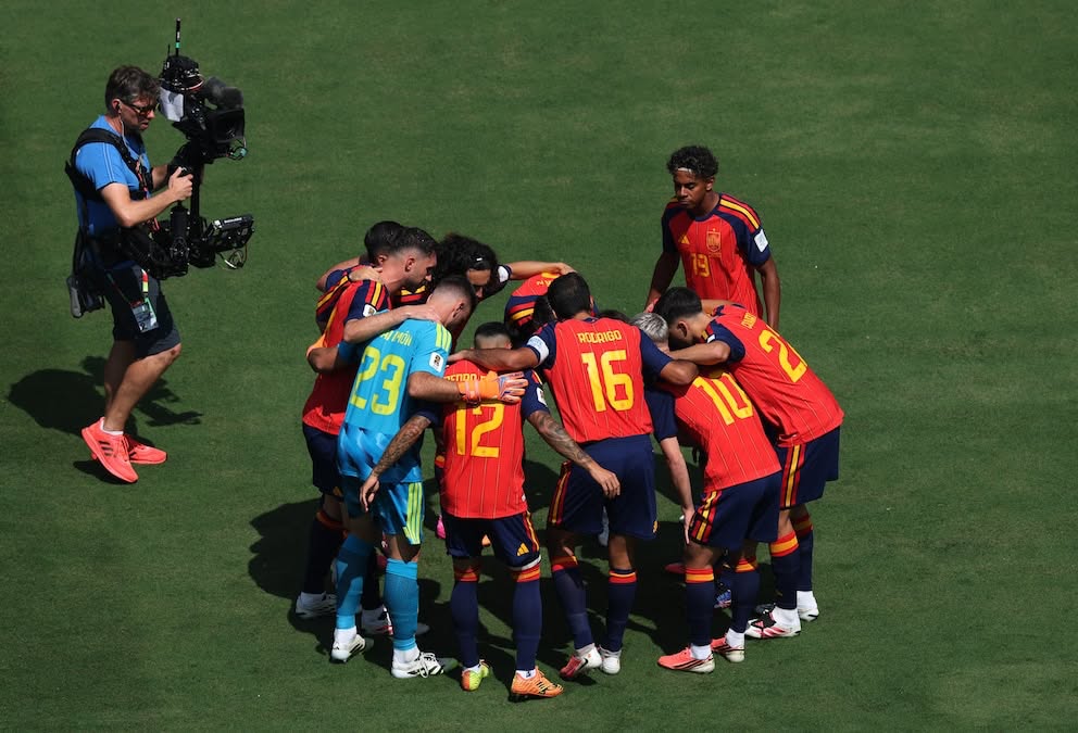 The champions huddle