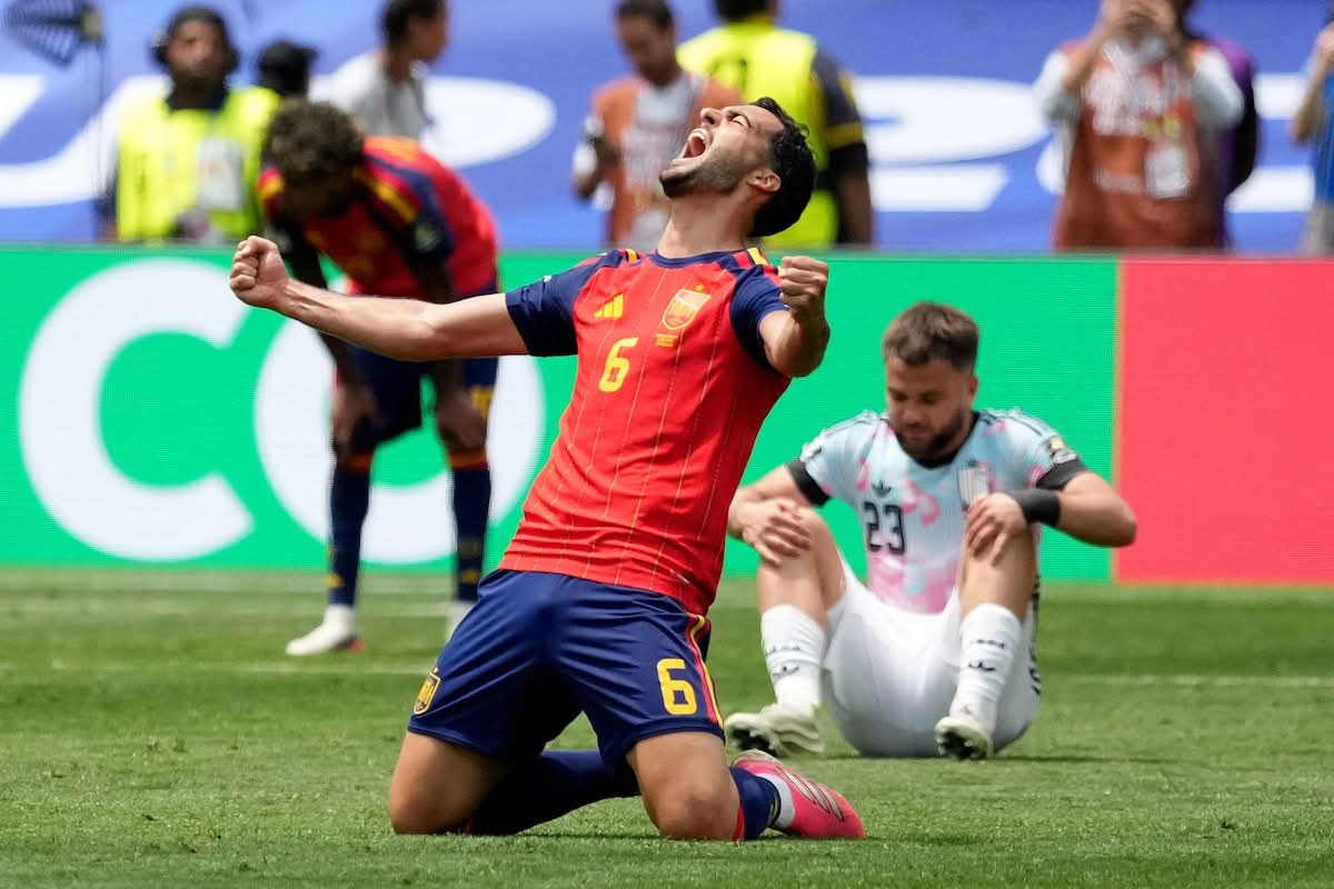 Rodri celebrates for Spain after the quarter-final against Belgium